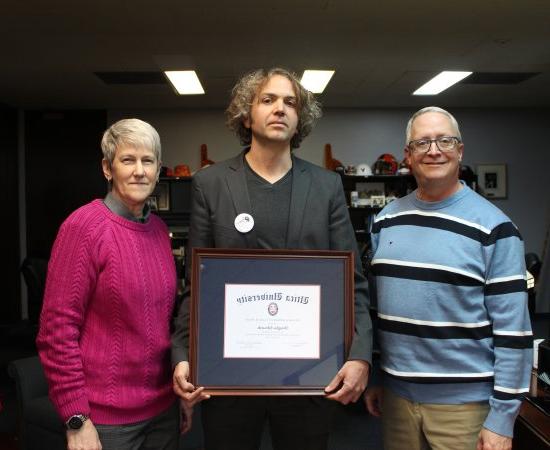 Douglas Edwards, with the 2023 Harold T. Clark Award, stands between President Todd Pfannestiel and Interim Provost Stephanie Nesbitt.